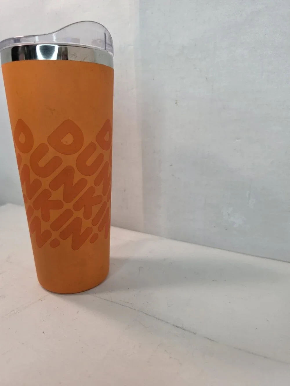 Dunkin' 20 oz Insulated Stainless Steel Tumbler, vibrant orange soft touch grip.